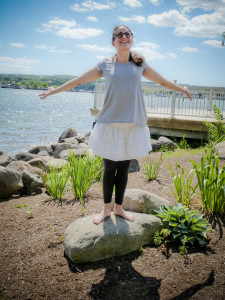 Standing on rock with hands to sky